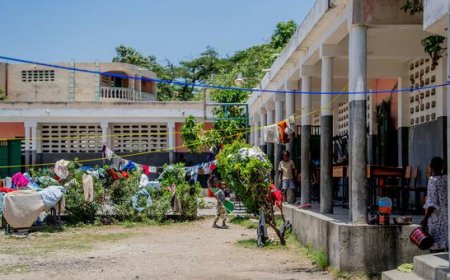 Desks become beds as Haitian school shelters people displaced by violence